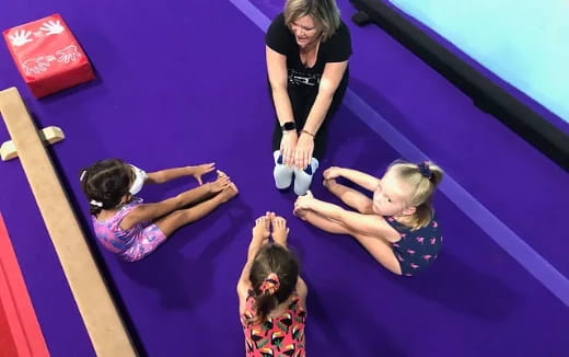 a group of women on a mat