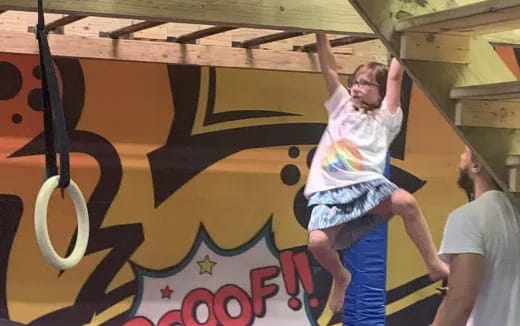 a person doing a handstand on a wall