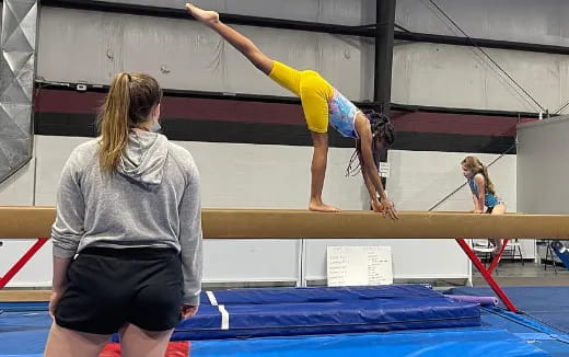 a woman doing gymnastics