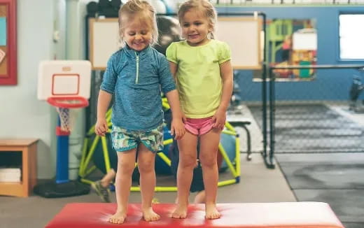 a couple of girls posing for the camera