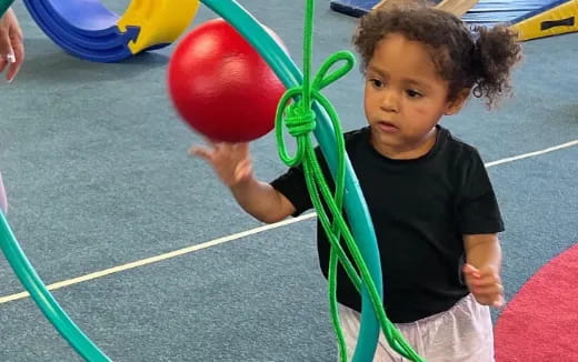 a child holding a balloon