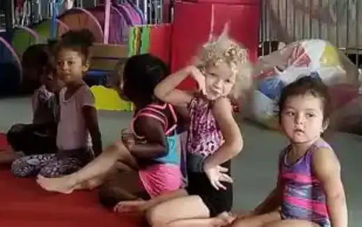 a group of children sitting on the floor