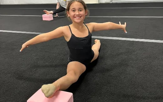 a girl doing a yoga pose