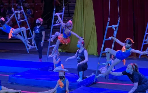 a group of women performing on a stage