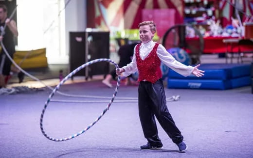 a person holding a large hoop