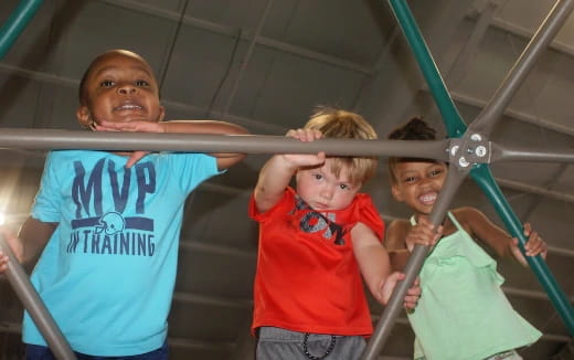 a group of kids in a gym