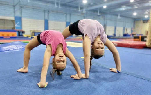 a man and woman doing yoga
