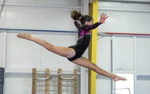 a woman doing gymnastics