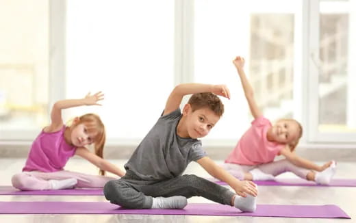 a group of children exercising