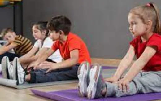 a group of children sitting on the floor