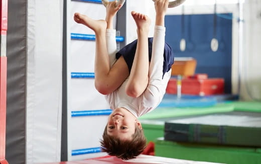 a woman doing a handstand