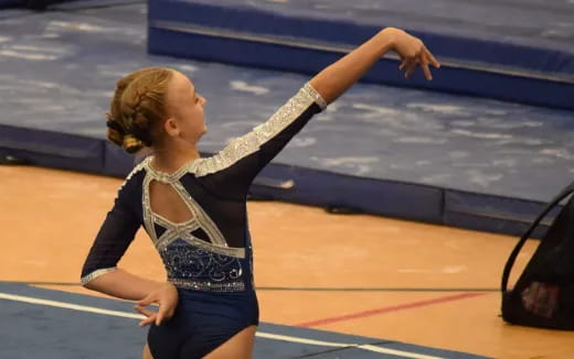 a woman in a track uniform