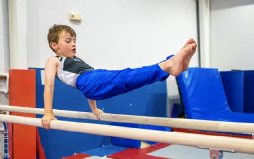 a boy doing gymnastics