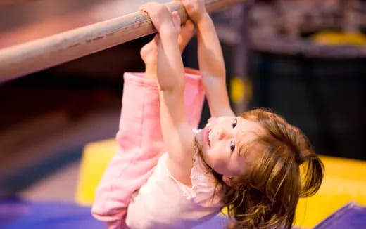 a girl doing a handstand