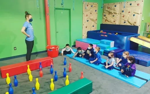 a person teaching children in a classroom