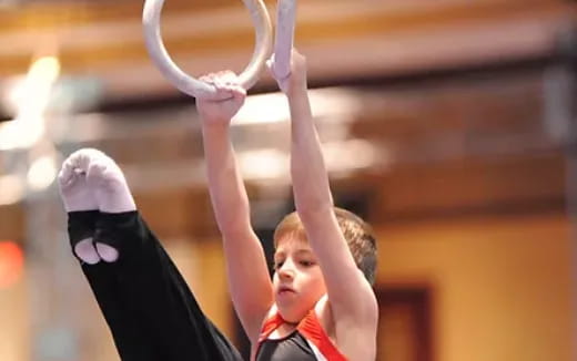a woman holding a white object above her head