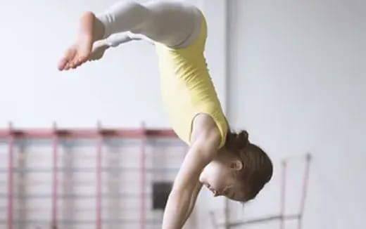 a woman doing gymnastics