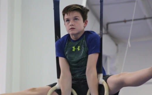 a boy sitting on a chair
