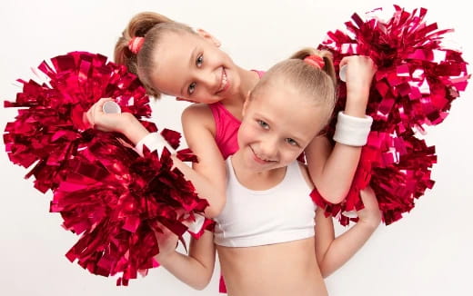 a couple of girls holding flowers