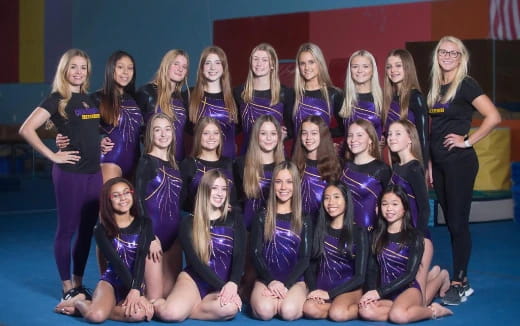 a group of women posing for a photo