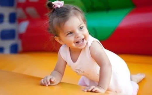 a baby crawling on the floor