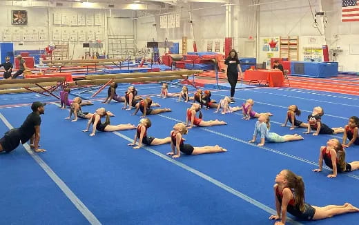 a group of people in a gym