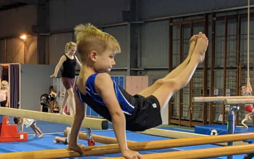 a boy doing gymnastics