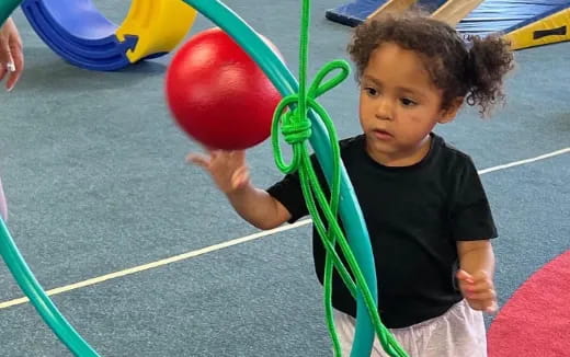 a child holding a balloon