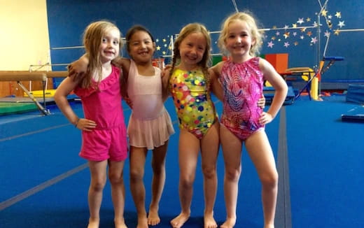 a group of girls posing for a picture