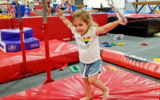 a child on a red mat