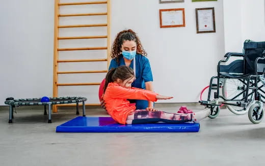 a person and a child in a room with a baby