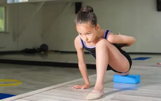 a young girl doing yoga