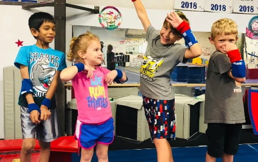 a group of kids playing with balls