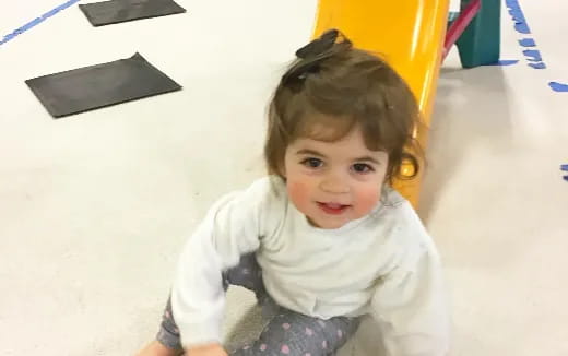 a child sitting on the floor