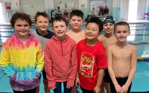 a group of boys posing for a picture