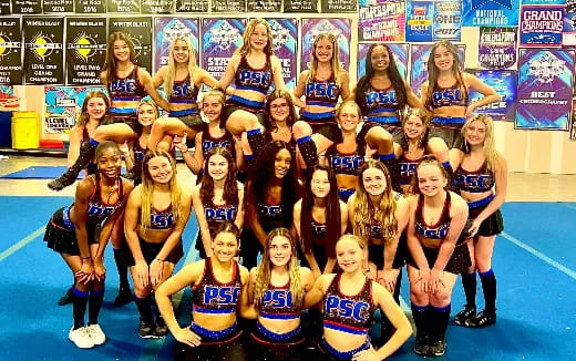 a group of women posing for a photo