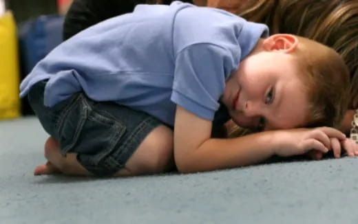 a boy lying on the ground