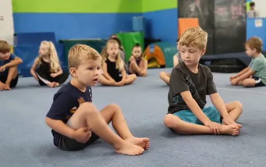 a group of children sitting on the floor