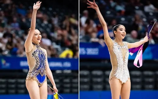 women in leotards holding microphones on stage