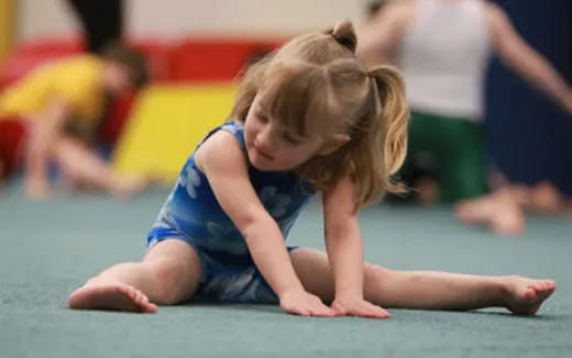 a young girl doing yoga