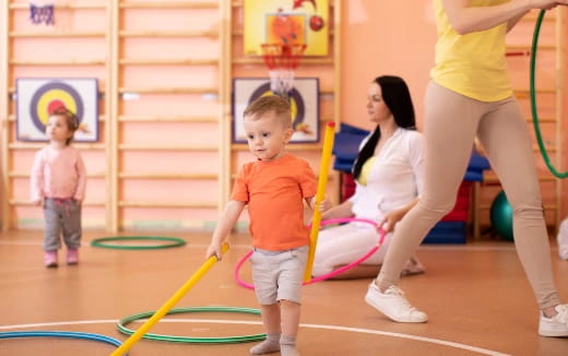 a person and a child playing with a toy