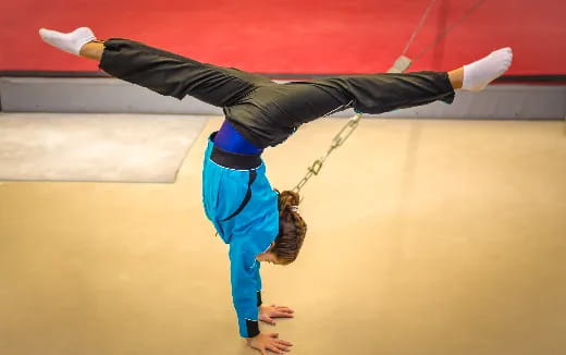 a man and woman performing acrobatics