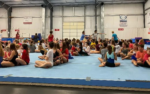 a group of people sitting on the ground