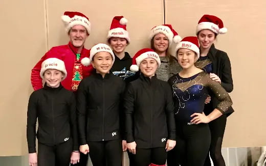 a group of people wearing santa hats