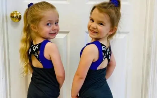 two girls wearing clothing