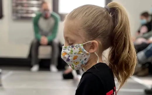 a little girl with a pacifier in her mouth