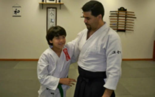 a man and a woman in karate uniforms