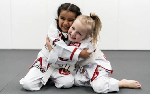 a man and a woman in karate uniforms