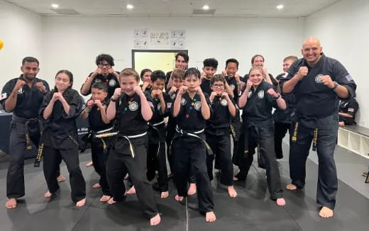 a group of people in black uniforms