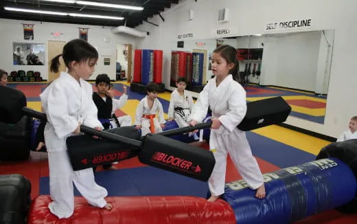 a group of people in karate uniforms